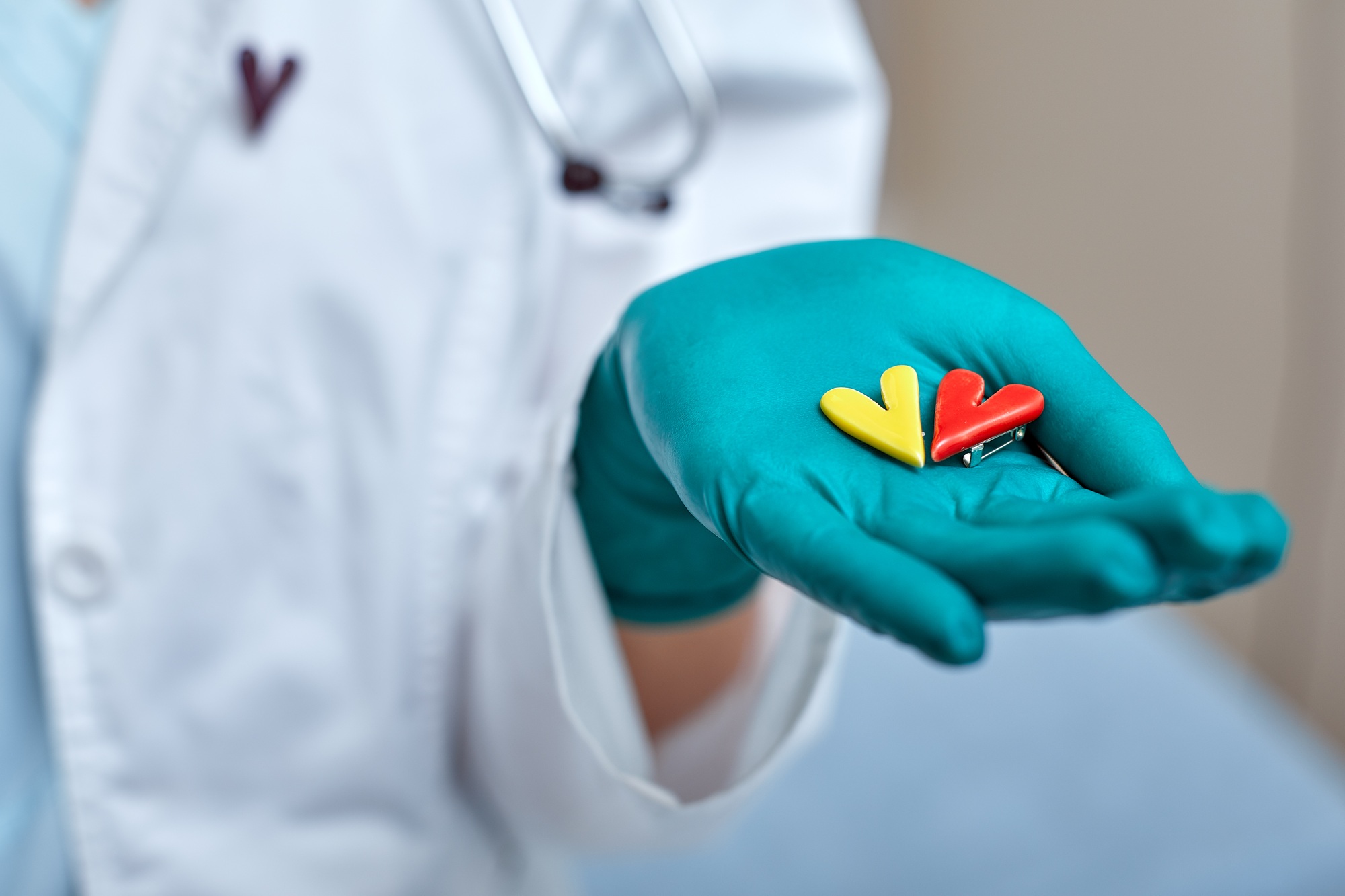 doctor holding simbols of heart in hand with medical care concept, Medicine in hospital, cardiology